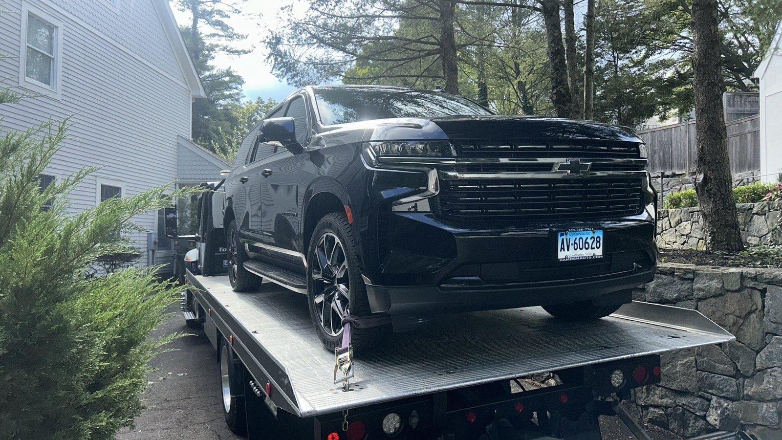 Black SUV on a flatbed