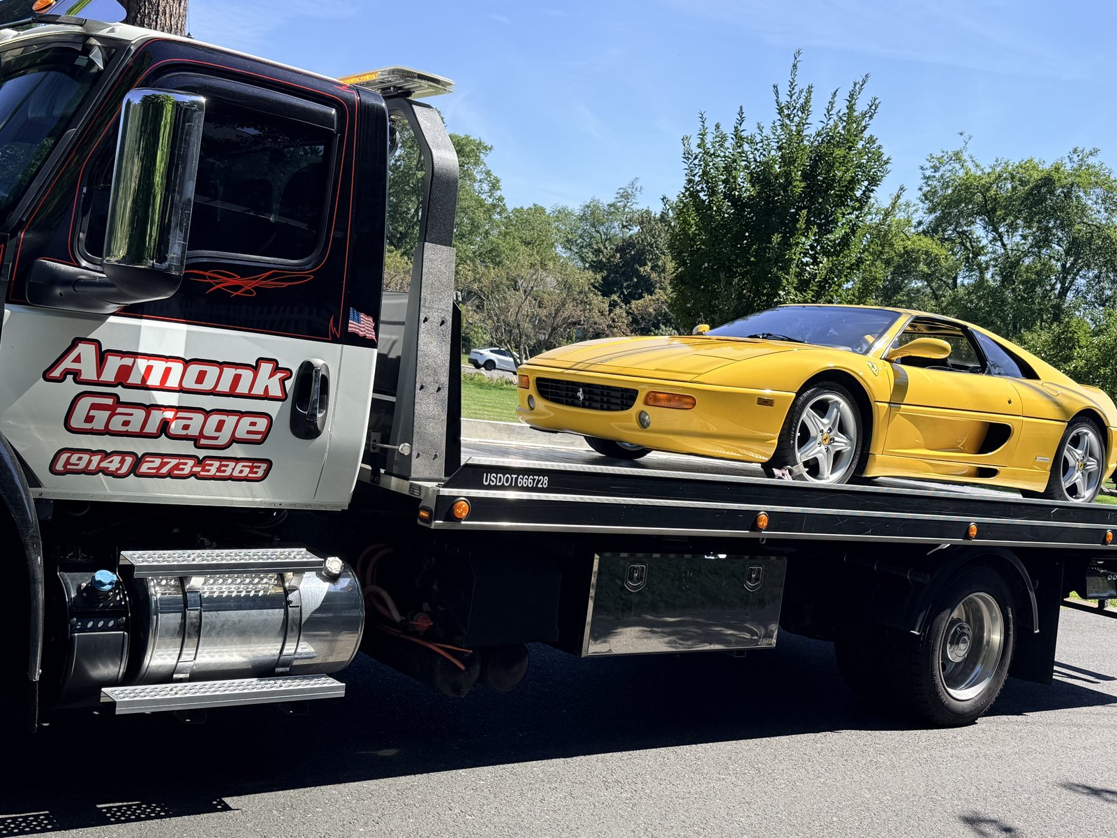 Yellow Ferrari on an Armonk Garage flatbed
